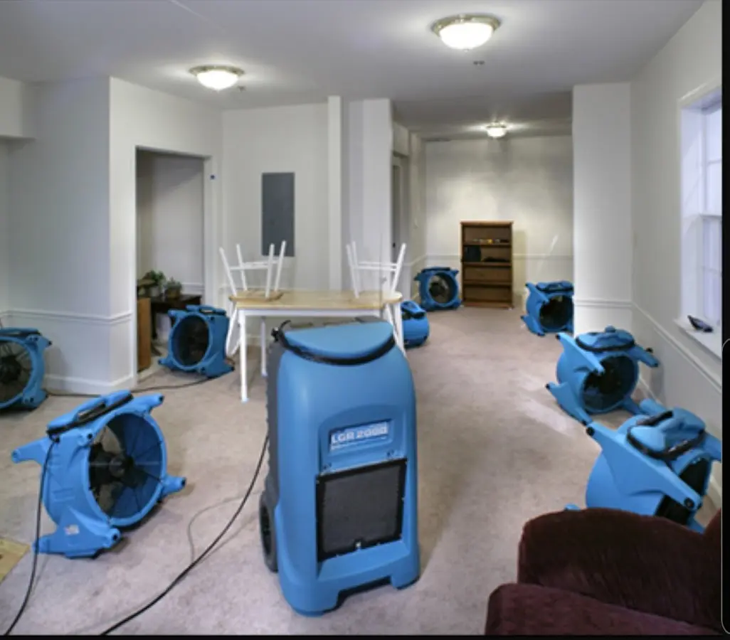 Air movers and dehumidifier setup for Water Damage Restoration in Marshfield